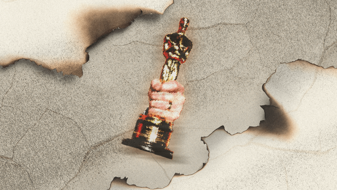 A pixelated hand gripping an Academy Award, surrounded by burnt paper
